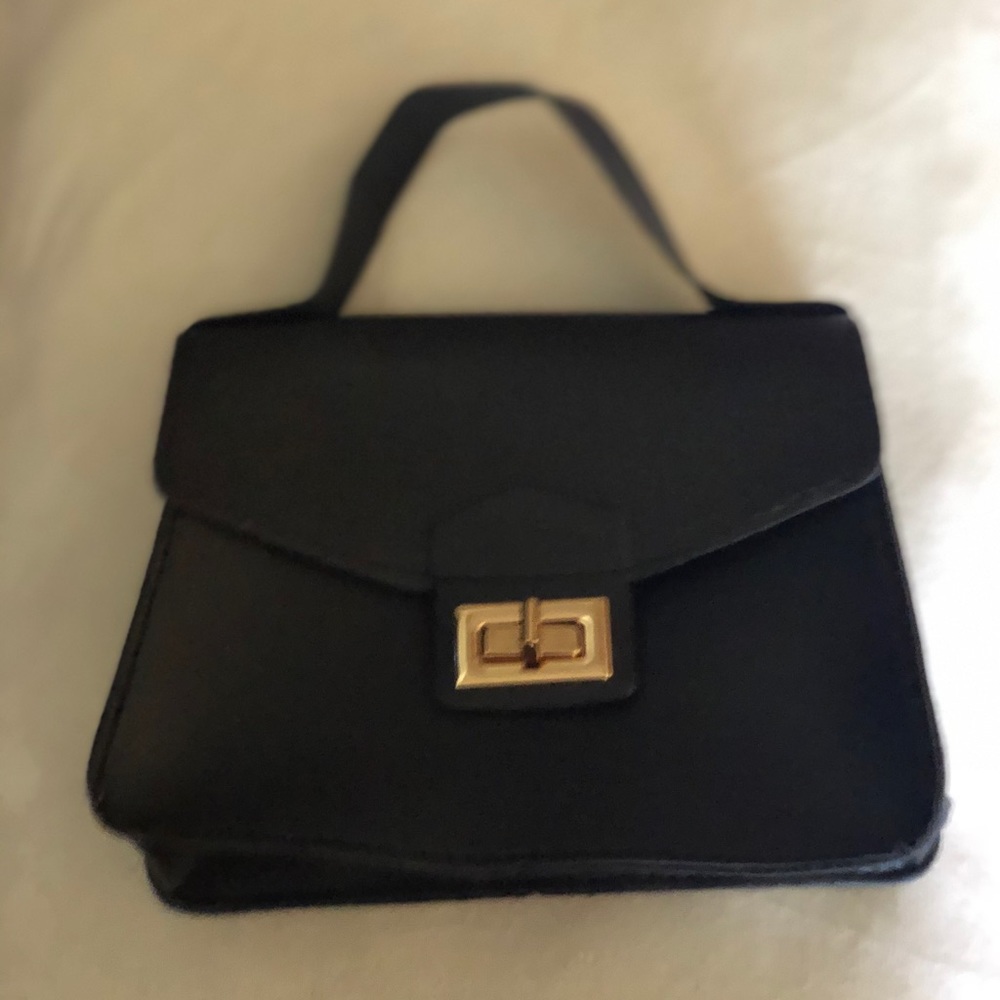 Mini black and gold purse